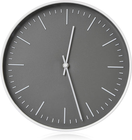 Dark gray clock with silver trim, no numbers, only silver lines show for where numbers would be.