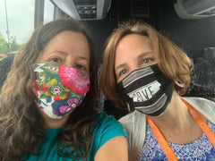 Photo of me and my friend Michelle on the bus, both wearing masks.