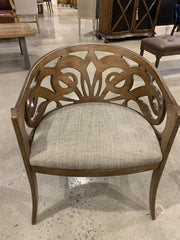 Accent wooden chair with a cool design cut out of the back.