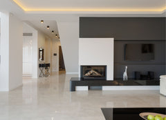 Living room looking toward a simple and modern fireplace.