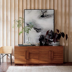 Wooden living room side board decorated with vase and twigs
