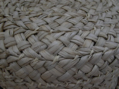 close up of a straw grass basket