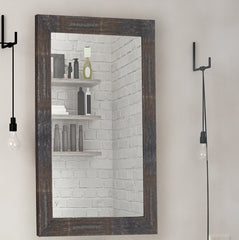 Natural wood frame mirror in a bathroom