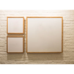 3 blank frames one a painted brick wall
