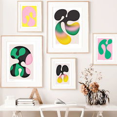 Gallery wall art of funky organic designs in pinks, greens and black.