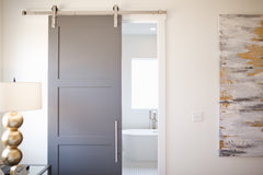 Modern bathroom with gray barn door