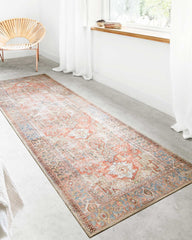 loloi terracotta sky rug runner in front of a white window.