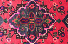 Close up of a rug medallion in pink