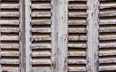 close up image of weather beaten shutters