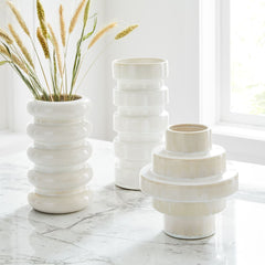 white ceramic geometric vases from west elm on a table