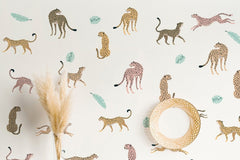 Wall with different colored leopard wall decals on it.