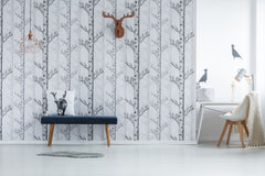 Tree wallpaper with deer decoration accents.