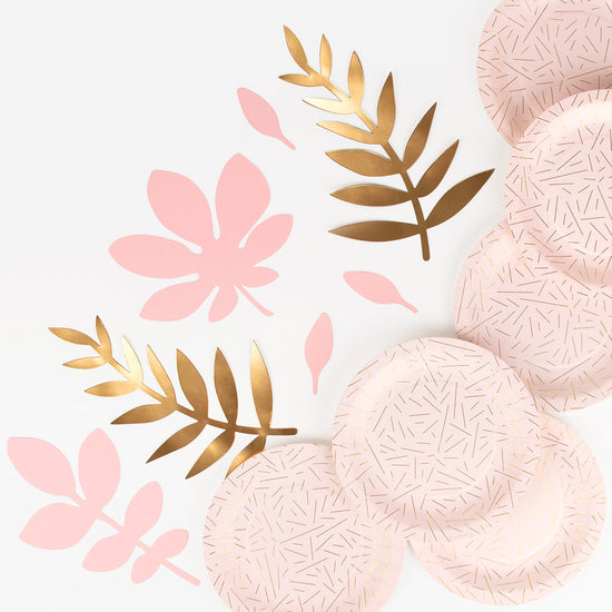 Wedding decor idea: paper plates and pink and gold paper leaves