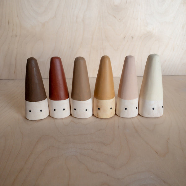 Hand carved Cone people