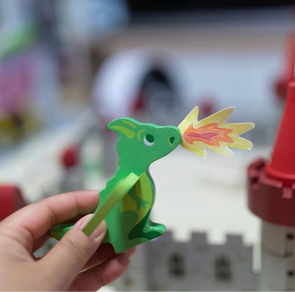 A child playing with a toy dragon