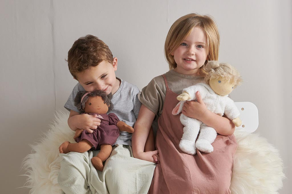 Children holding soft toys