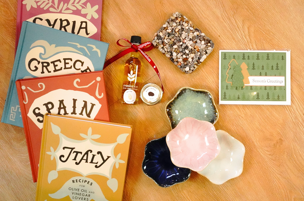 Gifts under $25 include country theme cookbooks, truffle popcorn kits, a set of 4 dip plates, and stone soap dishes