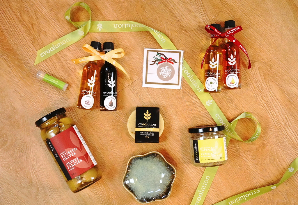 Gifts under $15 include feature 50ml pairings, tapenade, stuffed olives, soap, lip balms, and dip plates