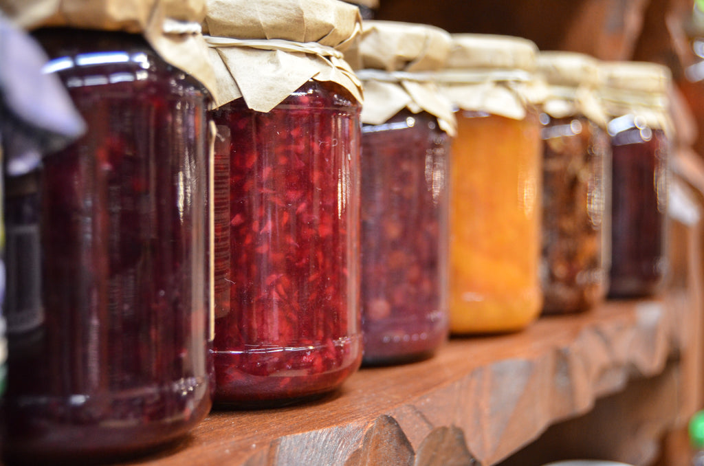 A row of colourful canning jars