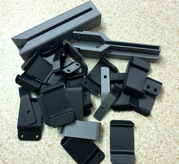 pile of 3D printing holsters