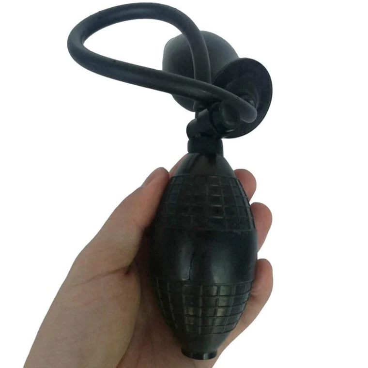 a hand holding inflatable dildo's pump