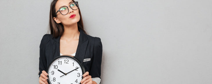 woman holding clock