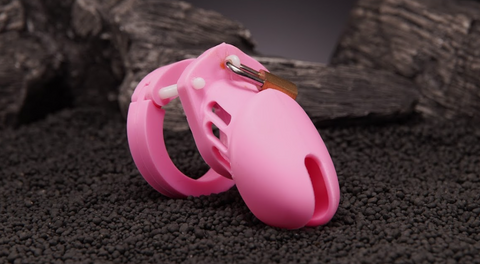 a pink chastity cage