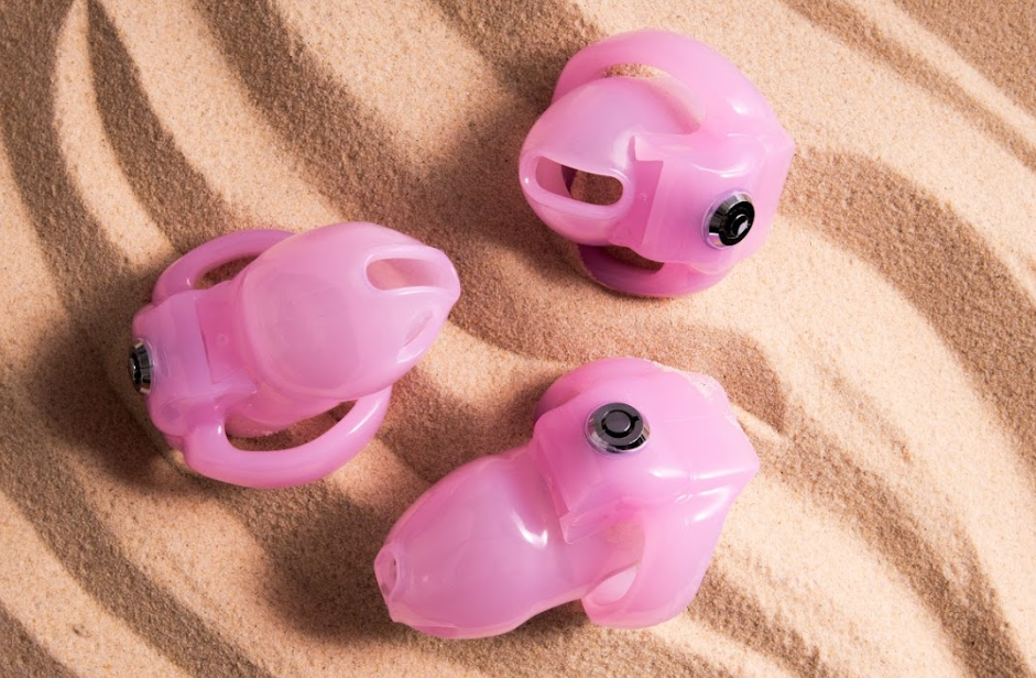 Three pink chastity cages