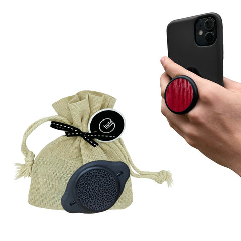 G-Hold Phone Holders come in sustainable linen gift bags which is the most sustainable packaging option. Image shows phone being held with the G-Hold Phone Holder in the most ergonomic way to hold a phone to prevent hand and wrist strain caused by using other pop-out phone grips.