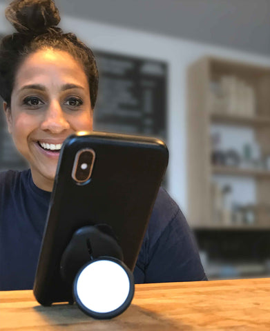 G-Hold offers friendly customer service and great user instructions. Image shows G-Hold Phone Holder standing on desk in portrait mode with smiling customer service