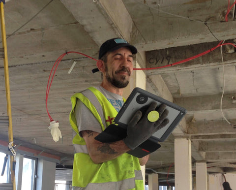 Durable G-Hold Tablet Holder being used on construction worker's iPad