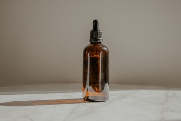 Castor oil in amber glass bottle