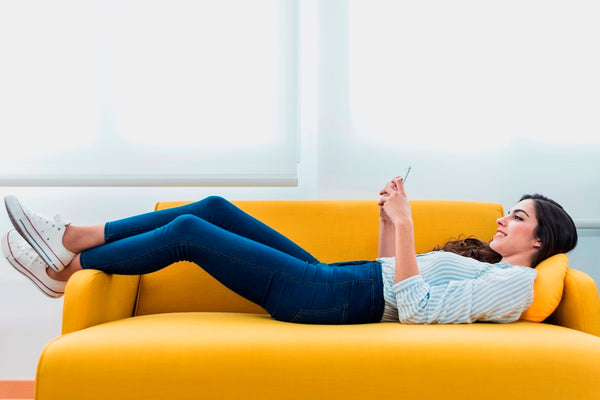 A girl lying down on the sofa