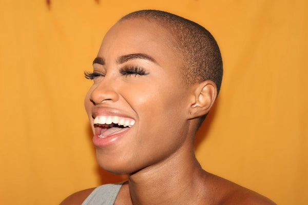 Bald women laughing