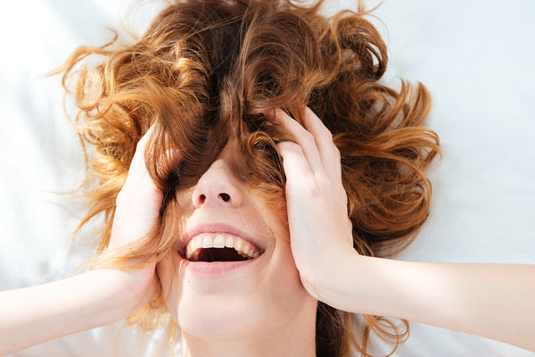 Happy woman with wavy hair