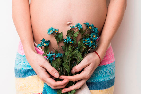 Holding blue flowers 