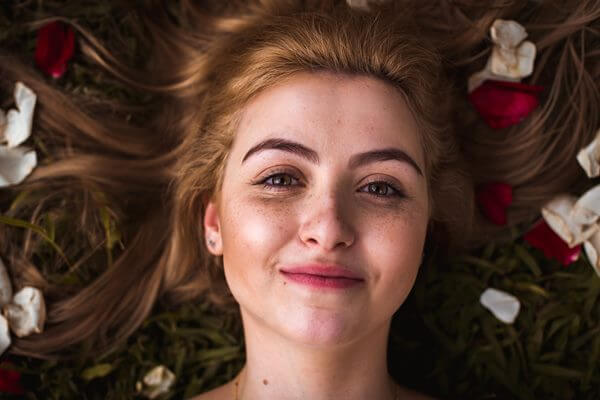 Smiling woman with clear and glowing skin