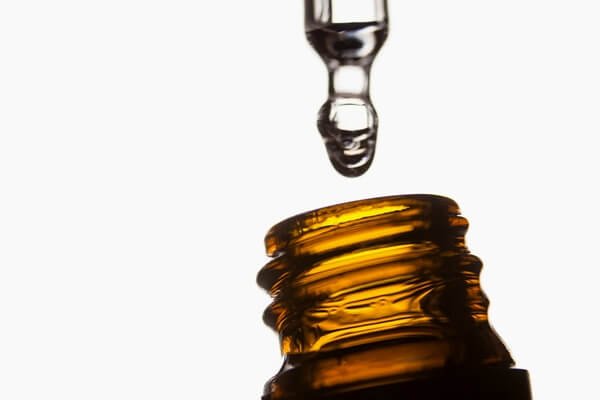 Serum in amber glass bottle