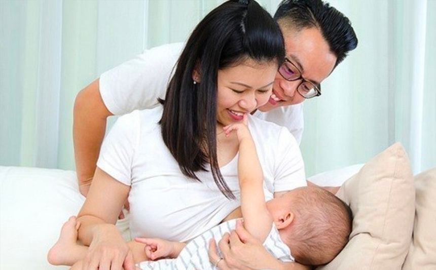 Couple holding baby