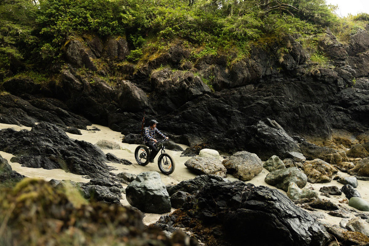 Rider on Surface 604 fat tire eBike traversing steep and challenging terrain