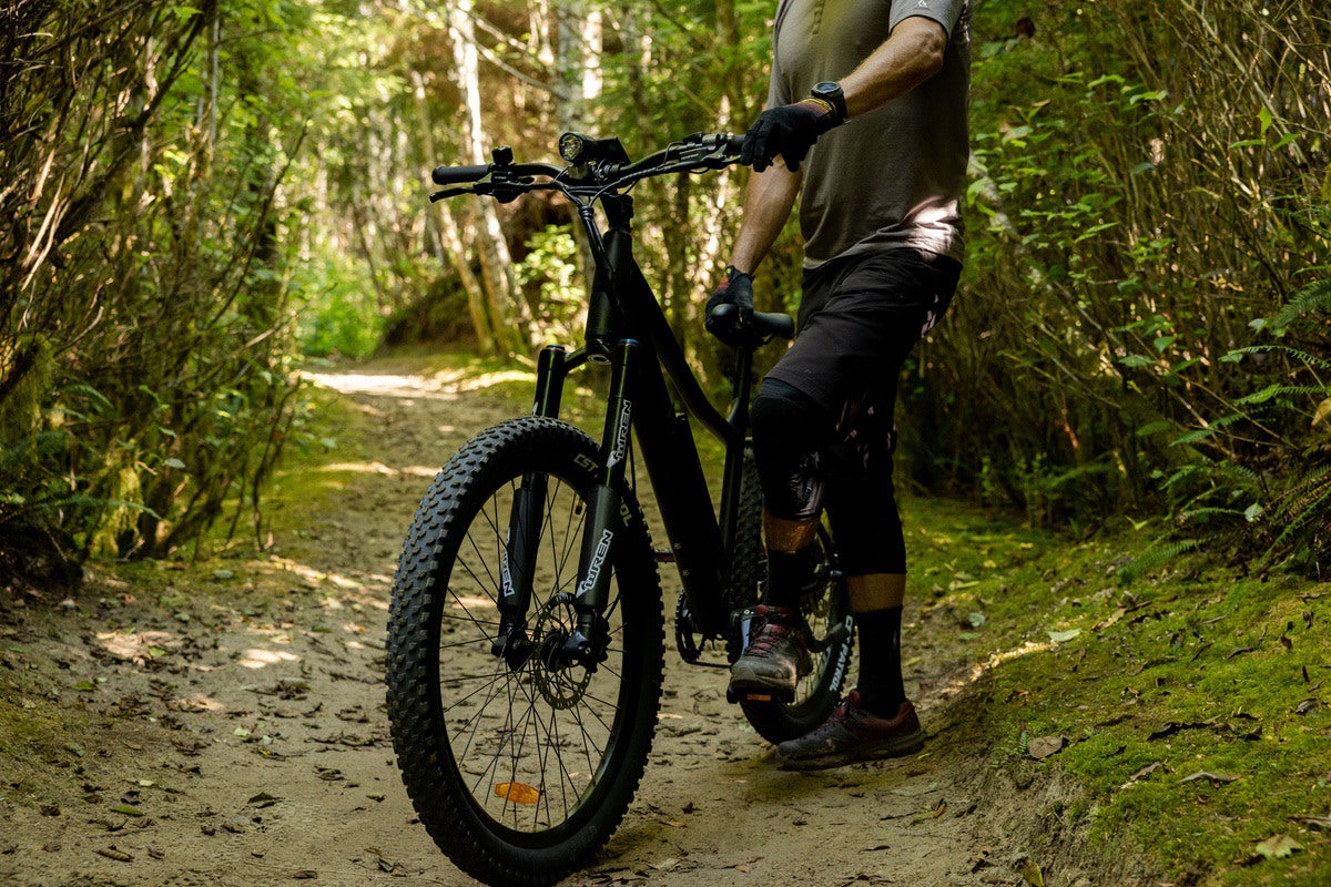Rider on Surface 604 eBike with hub drive motor and torque sensors in forest