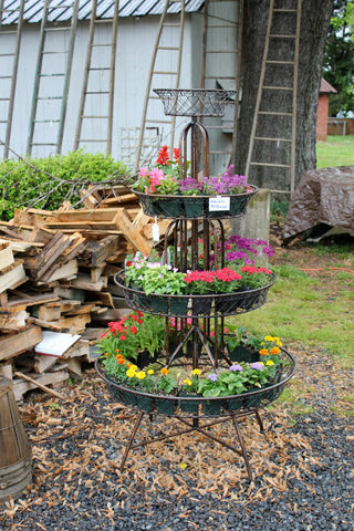 flowers in antique tiered planter