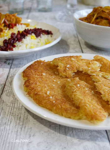 Tahdig in plate on white tablecloth