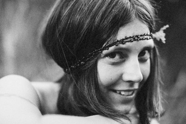 Young hippie women looking directly at the camera and smiling