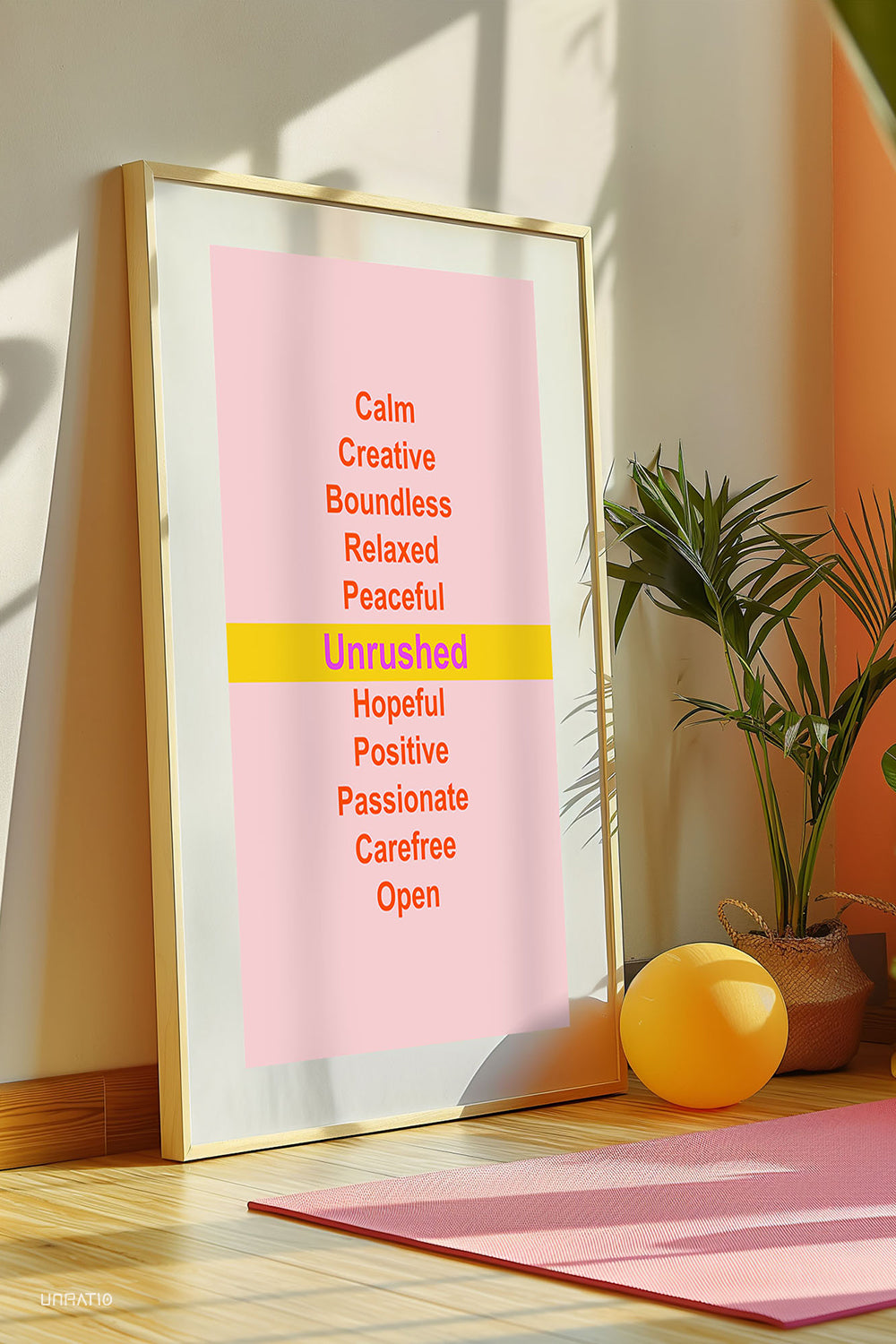 Framed motivational poster with peaceful affirmations on a pink backdrop, placed in a sunny room with yoga mat and plant, inspiring a tranquil lifestyle.
