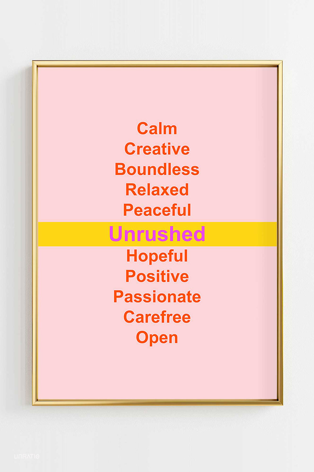 Framed typography poster with inspirational words like 'Calm', 'Unrushed', 'Hopeful', on a pink background, promoting mindfulness and positivity.