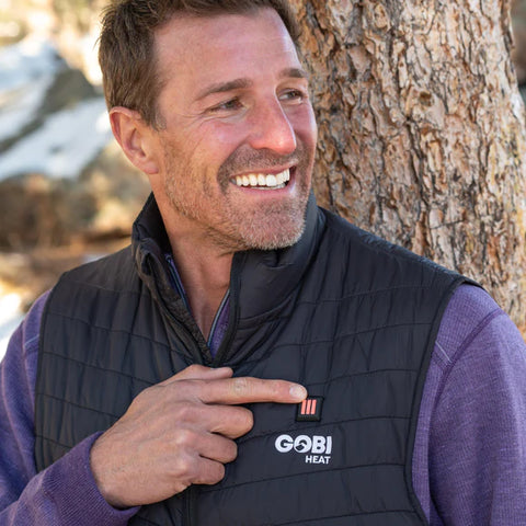 Comfortable and happy man wearing Gobi Heat Heated Vest outside
