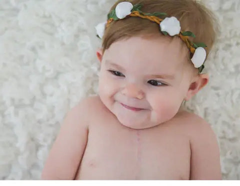 baby with flower headband