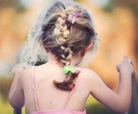 little girl with a barrette in her hair