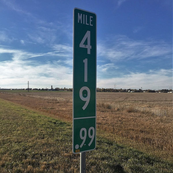A green highway mile marker sign in Colorado, reading 419.99